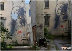 英国神秘街头涂鸦艺术大师Banksy原作《穿耳膜的少女》中的少女被戴上口罩